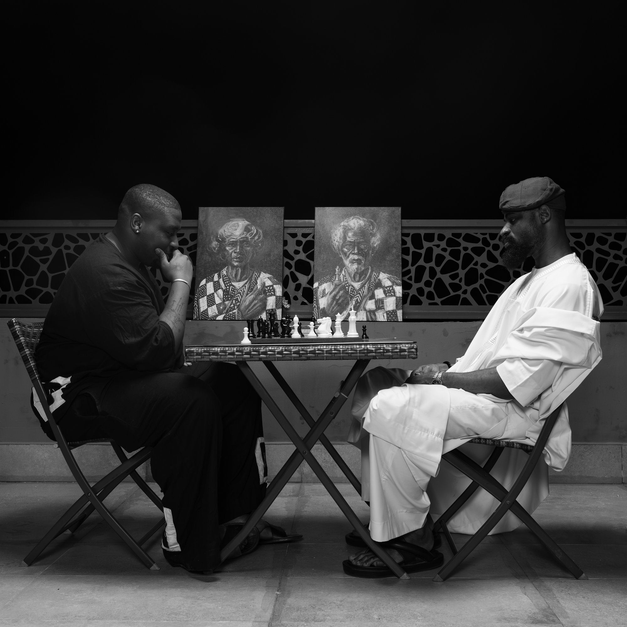 Anthony Azekwoh and Tunde Onakoya at the board, the Grandmasters between them